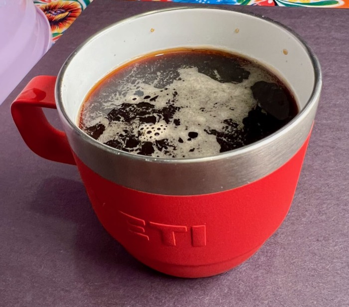 Soup-style black coffee in a red mug at Black Coffee Cafe