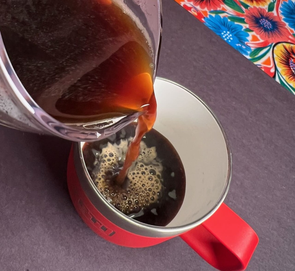Coffee being poured into a mug at Black Coffee Cafe